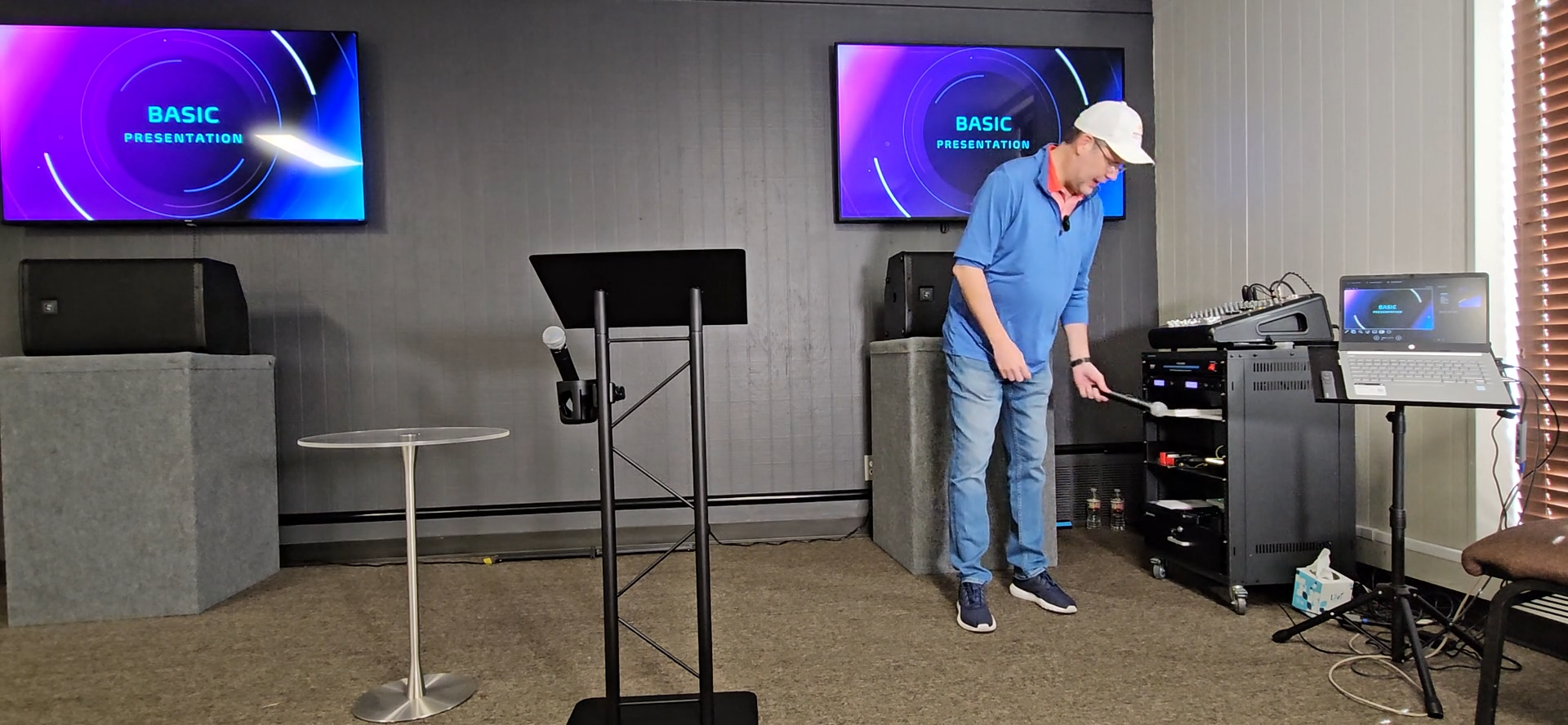 Step #7: Grab one of the handheld microphones from the rack.