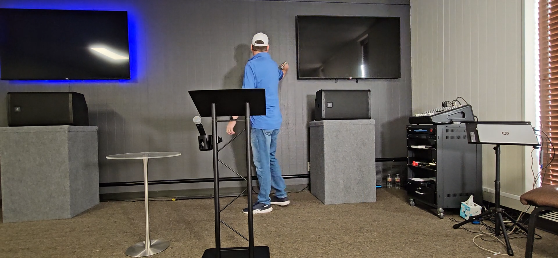 Step #25: Hold the remote close to the TV and press the power button to turn off the lights behind the television.