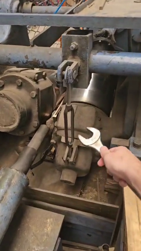 Step #6: Use the wrench to loosen the adjustment rod.