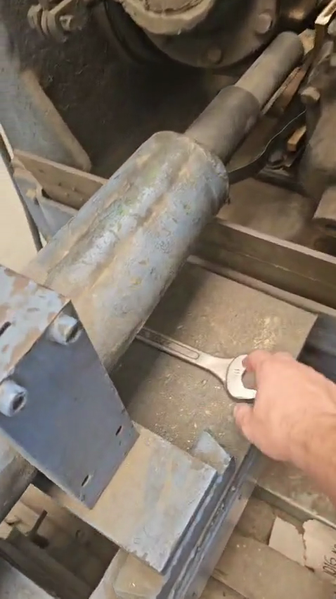 Step #5: Take a 1 and 1/8 inch wrench.