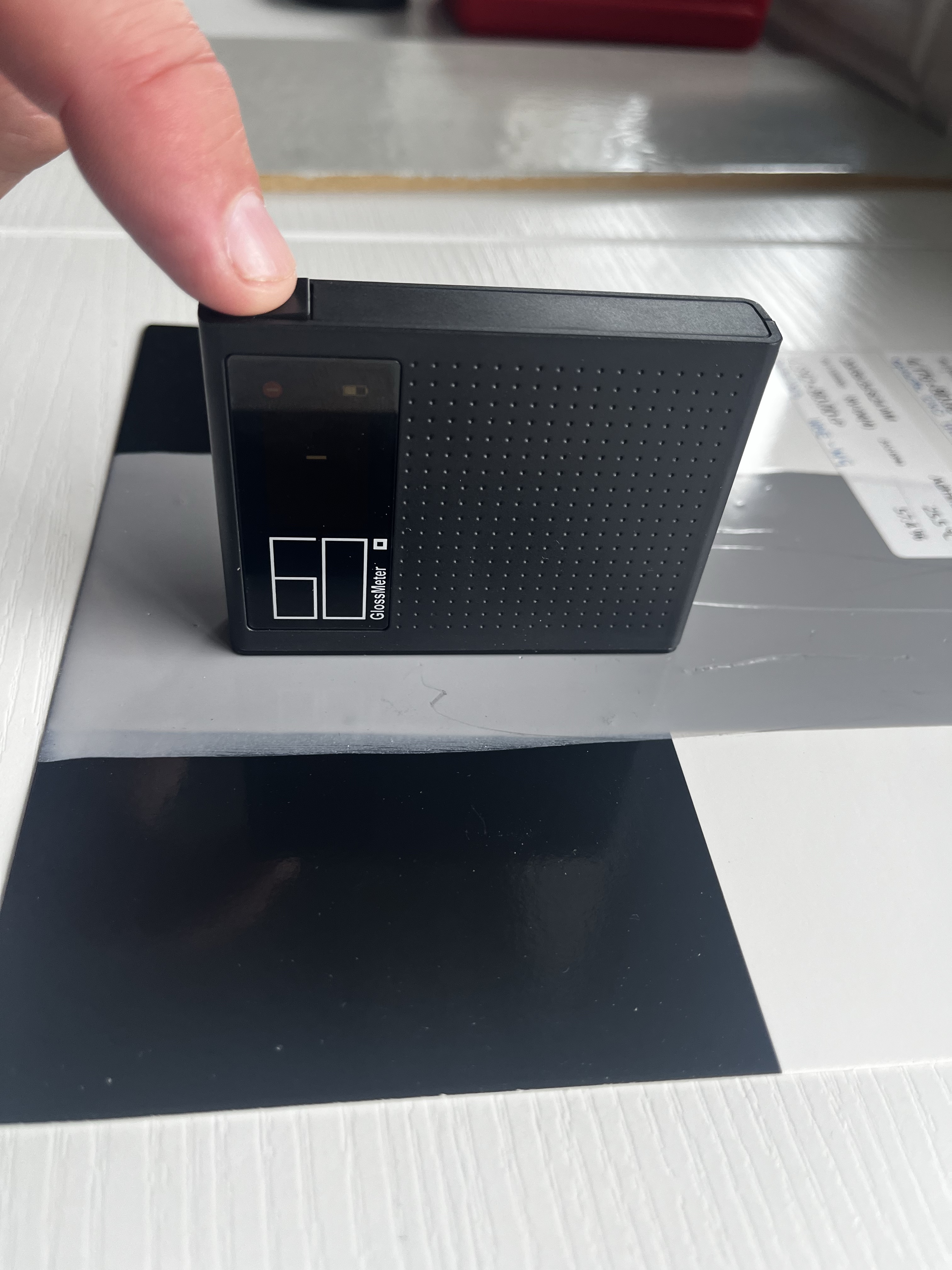 Step #4: Place the reader onto a cured sample and take the reading by pressing the power button once.